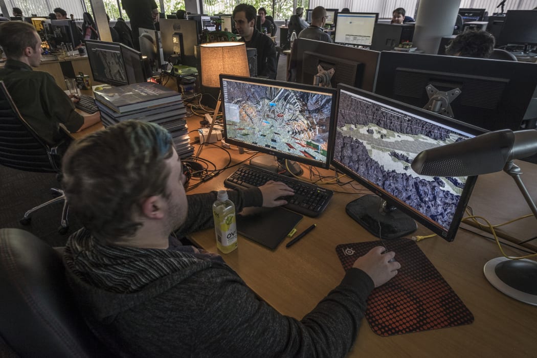 A programmer works on Grinding Gear Games' Path of Exile in their Henderson office which is the first PC game made by New Zealanders which will be launched on the Xbox platform.