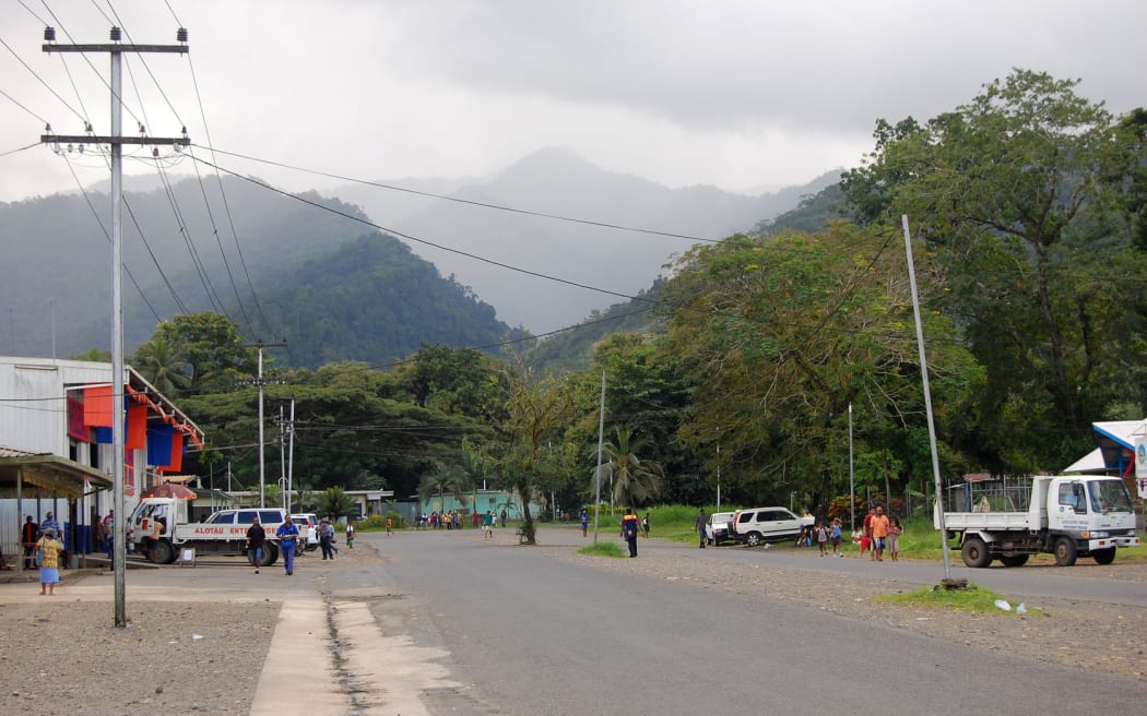 People at Alotau town street, hills view, Papua New Guinea, 2011.