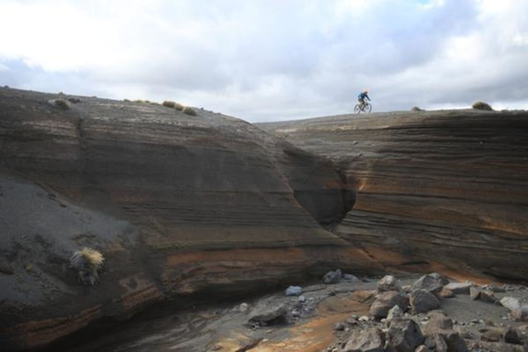 Mountain biking on the Tukino Skifield access road.