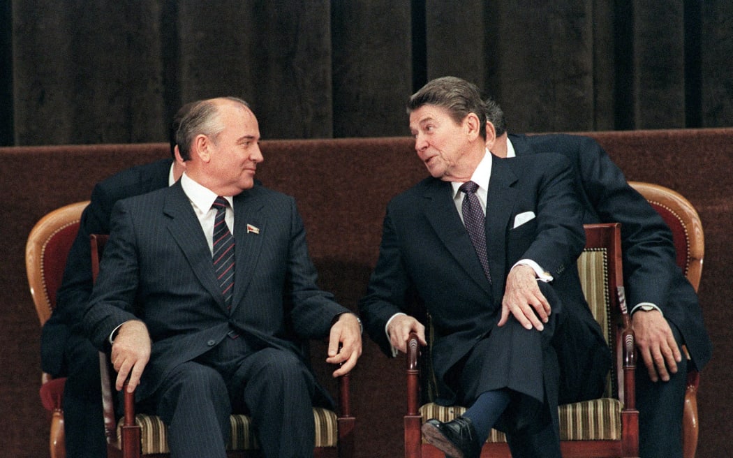 Photograph of President Ronald Reagan talking to Soviet general secretary of the Communist Party of the Soviet Union Mikhail Gorbachev. Dated 1985.