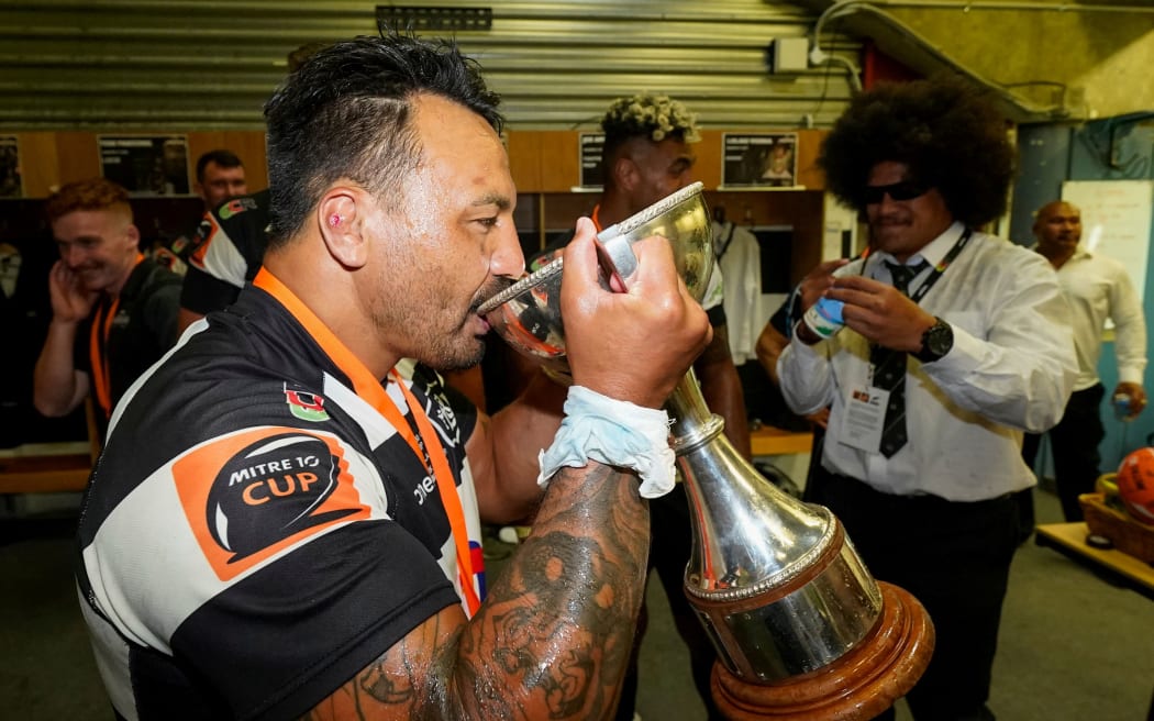 Hawke's Bay Ash Dixon drinks from the Cup after winning the 2020 Mitre 10 Cup Championship.