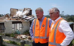 Northland MP Grant McCallum and Emergency Management Minister Mark Mitchell outside the Mangawhai home where a woman was seriously injured by a tornado.