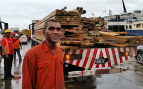 Leo at the Walu Bay wharf works long hours to load ships.