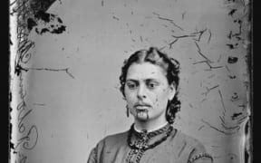 Head and shoulders studio portrait of a Maori woman with moko. c1871.
