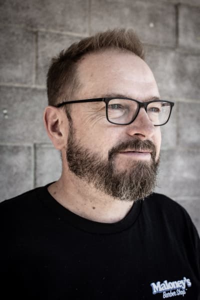 Julian Maloney of Maloney's Barbershop in Auckland says bald heads are in fashion.