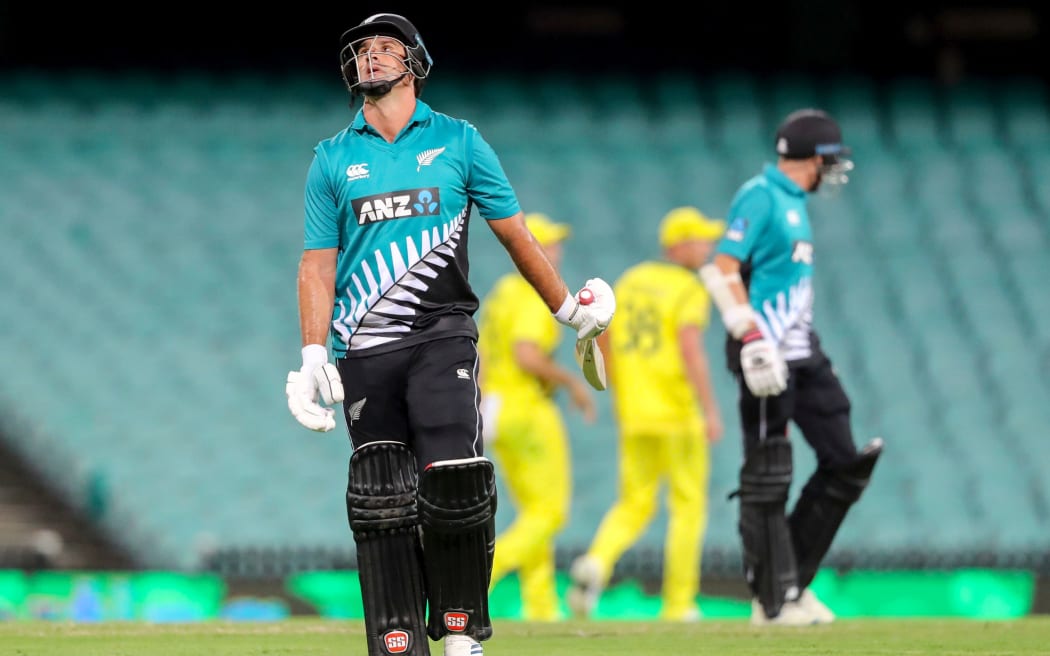 Black Caps all-rounder Colin de Grandhomme walks off an empty SCG after being dismissed.