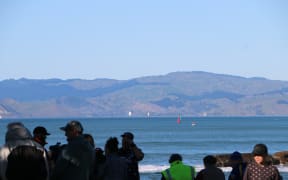 The Endeavour and the other tall ships sailed around past Te Kuri around 8am as onlookers gathered at Waikanae Beach to get a glimpse.