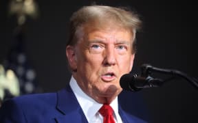 Former US President Donald Trump speaks at a campaign event on 2 April, 2024 in Grand Rapids, Michigan. Trump delivered a speech which his campaign has called 'Biden's Border Bloodbath', as recent polls have shown that immigration and the situation at the US southern border continue to be top issues on voters' minds going into the November election.