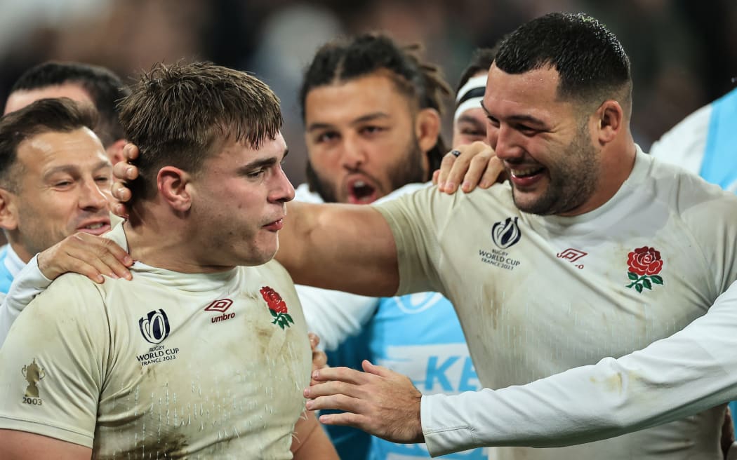 England’s Theo Dan celebrates scoring their second try with teammates in the thrid-place play-off against Argentina.