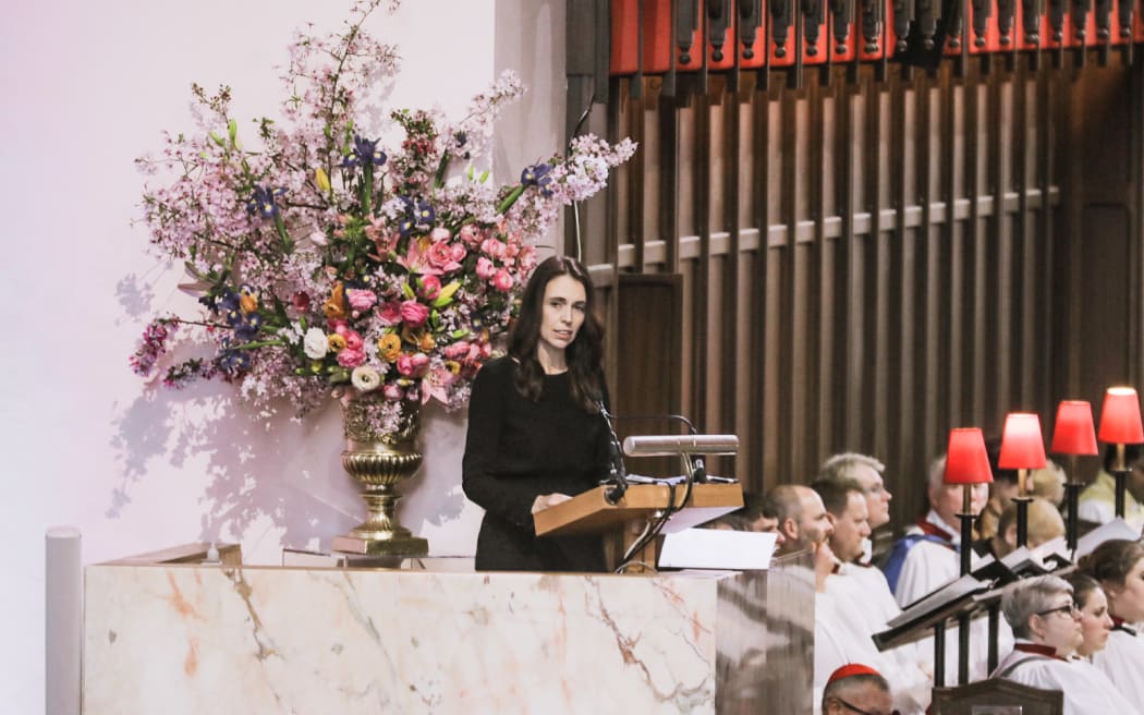 Prime Minister Jacinda Ardern reads an extract from a souvenir book published after the Queen's first visit to New Zealand during the Queen Elizabeth II memorial service at the Wellington Cathedral of St Paul.