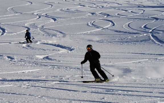 Skiers get in their first turns for the 2014 snow season at Mt Hutt.