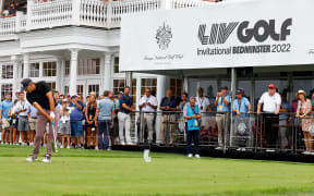 Former President Donald Trump watches as Sergio Garcia of Spain tees off during LIV Golf Invitational Series in New Jersey 2022.