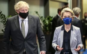 Britain's Prime Minister Boris Johnson is welcomed by European Commission President Ursula von der Leyen at the EU headquarters in Brussels.