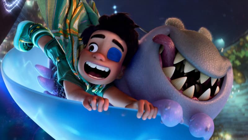 Elio, a young boy in an animation movie, flying on a board with an alien creature called Glordon.