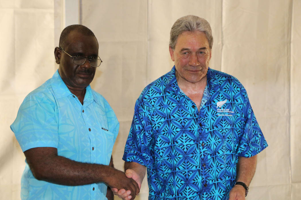 The foreign affairs ministers of New Zealand and Solomon Islands, Winston Peters (R) and Jeremiah Manele (L) shake hands after signing an agreement   for continued support in Honiara. June 2019