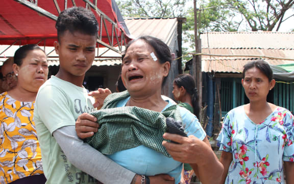 YANGON, MYANMAR - MARCH 27: Relatives mourn at the funeral of a person, who was killed during a demonstration against the military coup in Yangon, Myanmar on March 27, 2021.