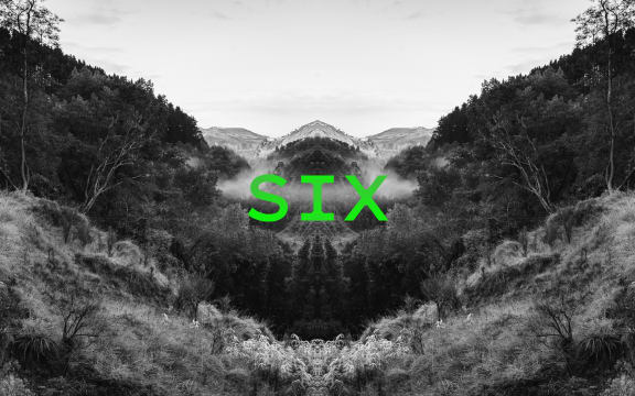 Podcast episode image for the 'Mr Lyttle Meets Mr Big' podcast. A moody black and white photograph of a misty country valley is mirrored vertically creating a Rorschach like effect with the episode number 'SIX' overlaid in vibrant green.