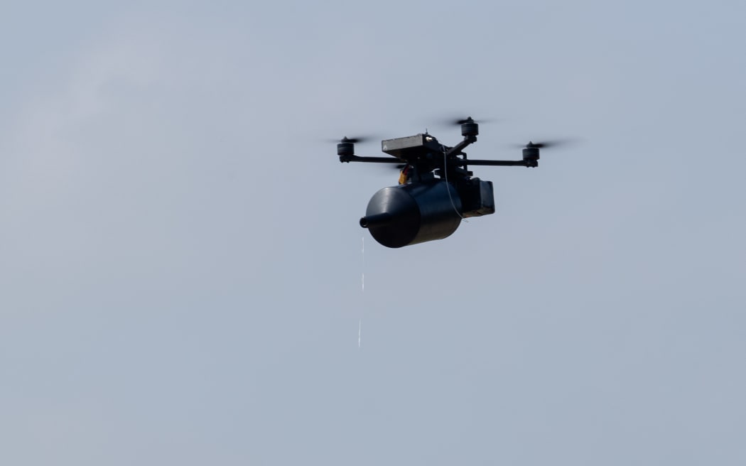 An fpv or First-Person View, drone Stalker, using fiber optic, flies during tests at an undisclosed location, on July 10, 2025, amid the Russian invasion of Ukraine. Fpv drone Stalker - made by the Ukrainian company and has been tested, put into service to the Security and Defense Forces of Ukraine, and received NSN codes. (Photo by Tetiana DZHAFAROVA / AFP)