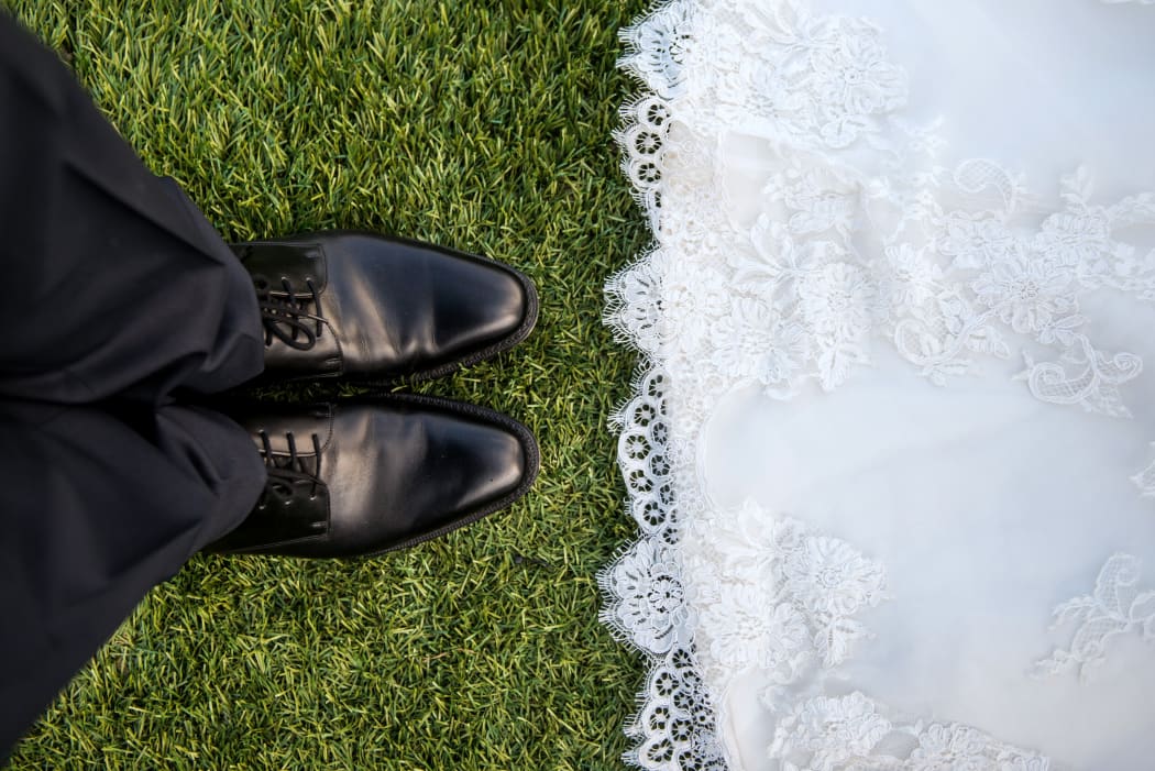 wedding mens shoes and edge of gown