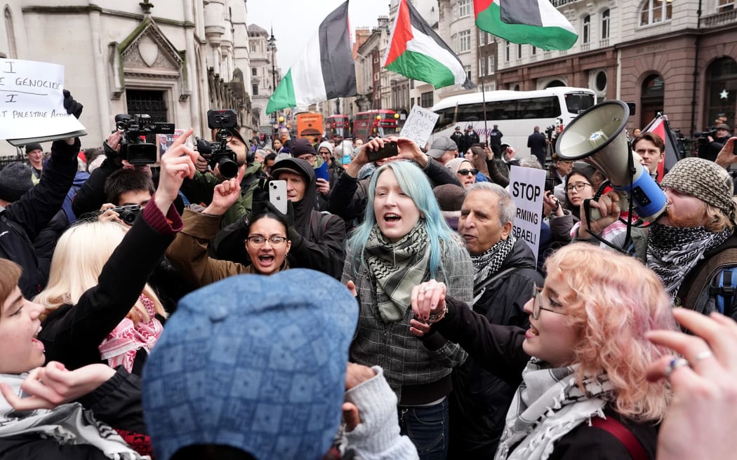 Protesters celebrate outside the High Court in central London after Friday's ruling that the Palestine Action terror ban was unlawful.