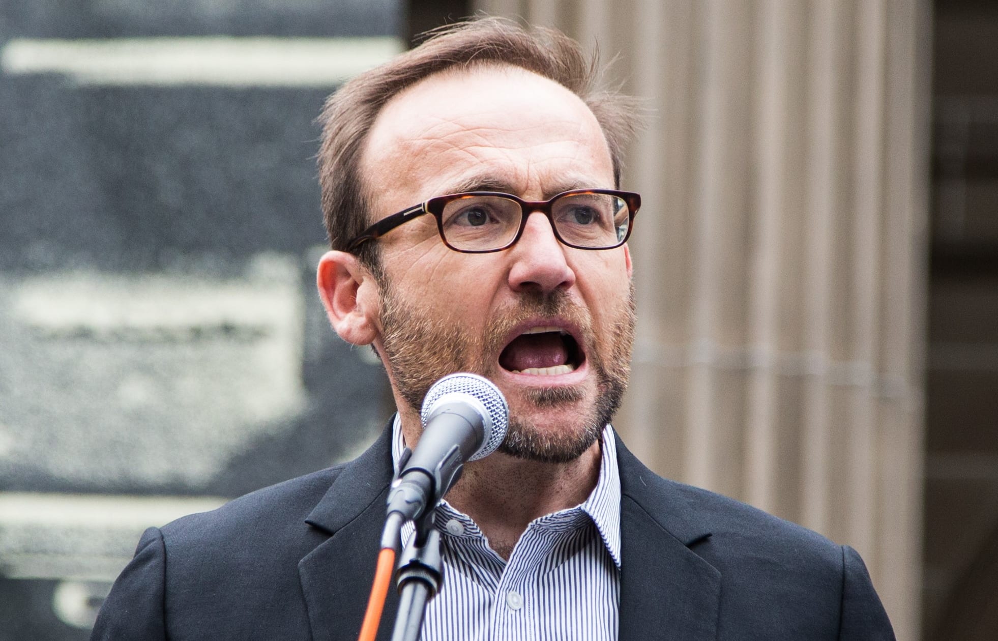 Green Party MP Adam Bandt addresses the crowd during a protest against US President Donald Trump and Australian Prime Minister Malcolm Turnbull and their Immigration and Refugee policies in Melbourne.