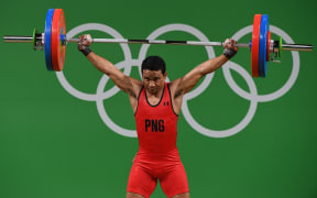 Papua New Guinea's Morea Baru competes during the Men's 62kg weightlifting competition at the Rio 2016 Olympic Games.