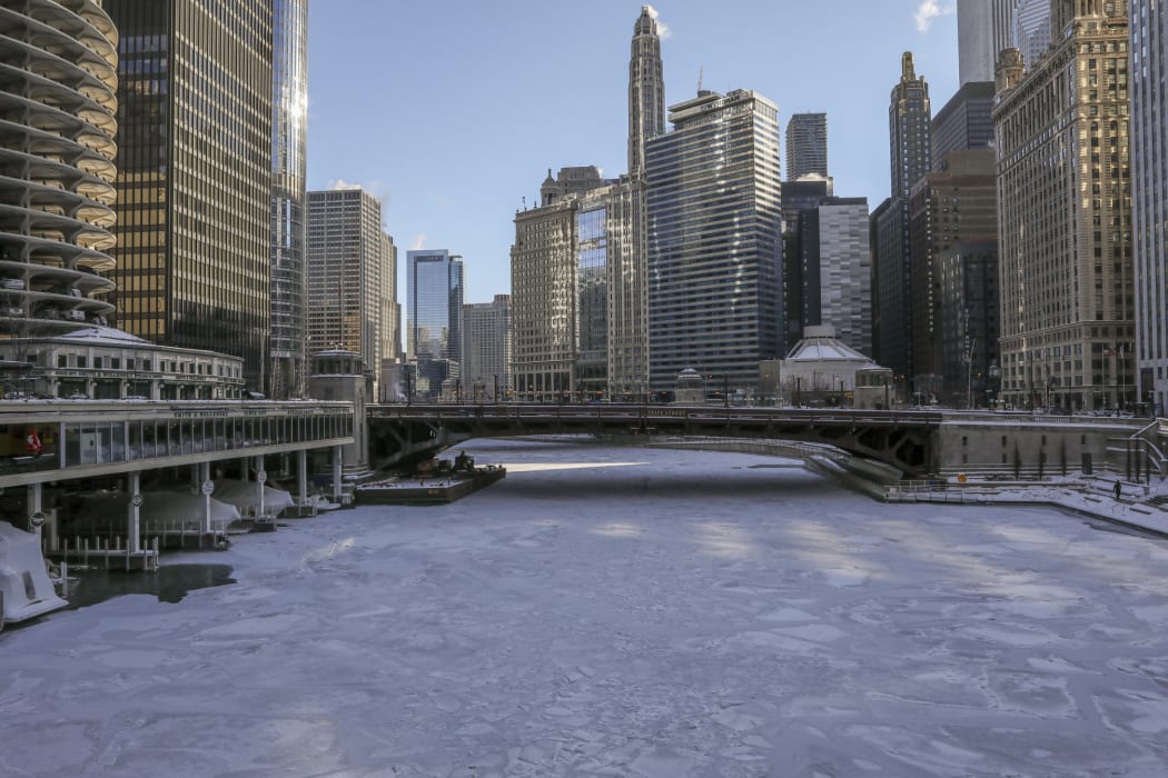 Ice covers the Chicago River today in Chicago.