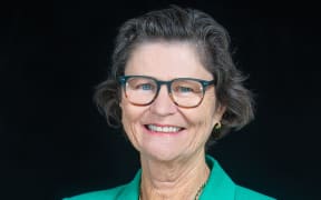 Ministry of Education of New Zealand. Profile Imagery of Iona Holsted Chief Executive and Secretary for Education. Black background with green jacket. Photo : February 2022 - Jeff McEwan / Capture Studios