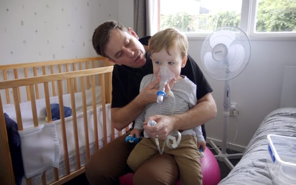 Eddie Porter with his son Otis, who has cystic fibrosis.