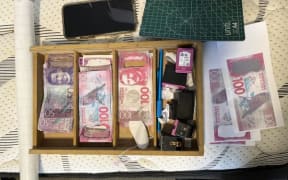 The counterfeit cash found by police.