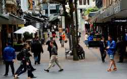 AUCKLAND,NZ - OCT 13 2015:Traffic on Vulcan Lane in Auckland downtown, New Zealand .It’s a popular cobblestone plaza off Queen St home to fashionable restaurants, cafes, pubs and stores.
