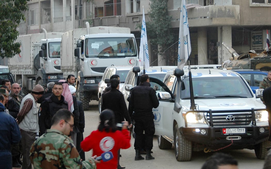 The official Syrian Arab News Agency released images of UN and Syrian Red Crescent vechicles in Homs.