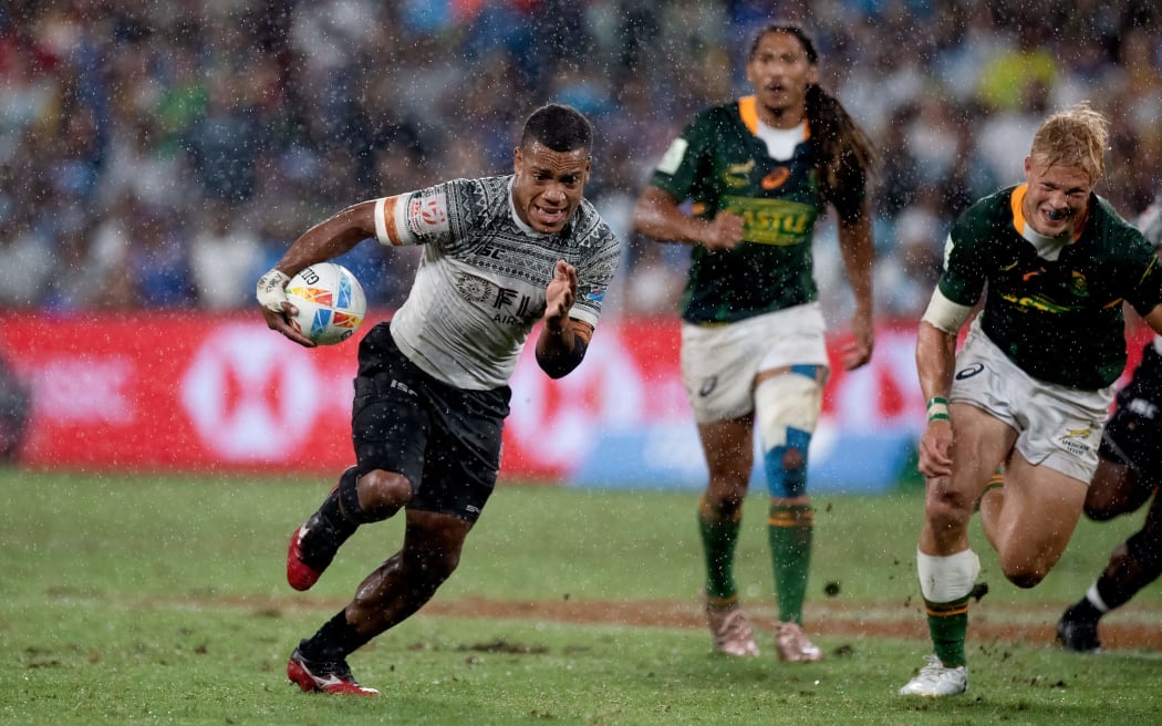 Fiji's Napolioni Bolaca runs away to score in the 2020 Sydney Sevens Cup Final against South Africa.
