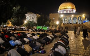 Palestinians pray outside Jerusalem's Al-Aqsa Mosque during the holy Night of Destiny, Laylat al-Qadr.