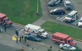 A video grab (courtesy of CNN and KOMO TV News) shows police and ambulances at Marysville-Pilchuck High School.