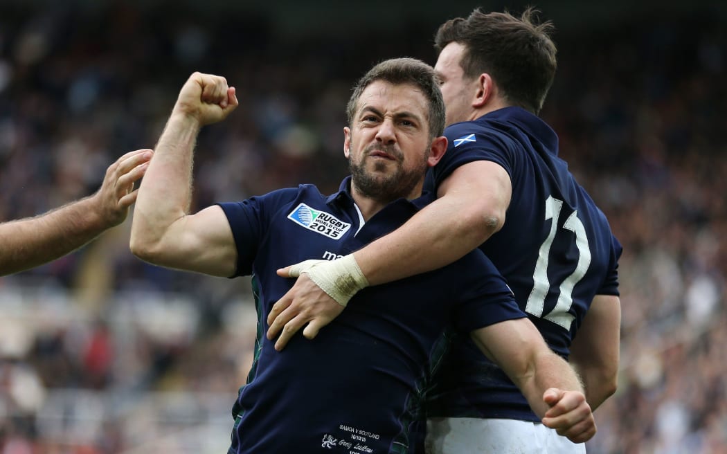 Scotland captain Greig Laidlaw celebrates his match-winning try, flanked by Tommy Seymour (L) and Matt Scott (R) late in the game against Samoa, Rugby World Cup, St James' Park, Newcastle 10 October 2015
***PLEASE CREDIT: FOTOSPORT/DAVID GIBSON***