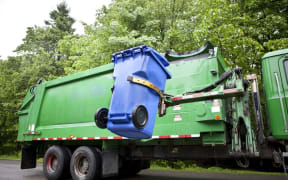 WorkSafe says recycling companies should review how they prevent people from climbing into bins (file picture).