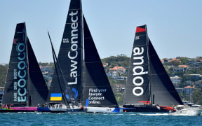 (L-R) Stefan, LawConnect, and Andoo Comanche are seen during the start of the Sydney Hobart Yacht Race 2022 in Sydney Harbour, Monday, December 26, 2022.