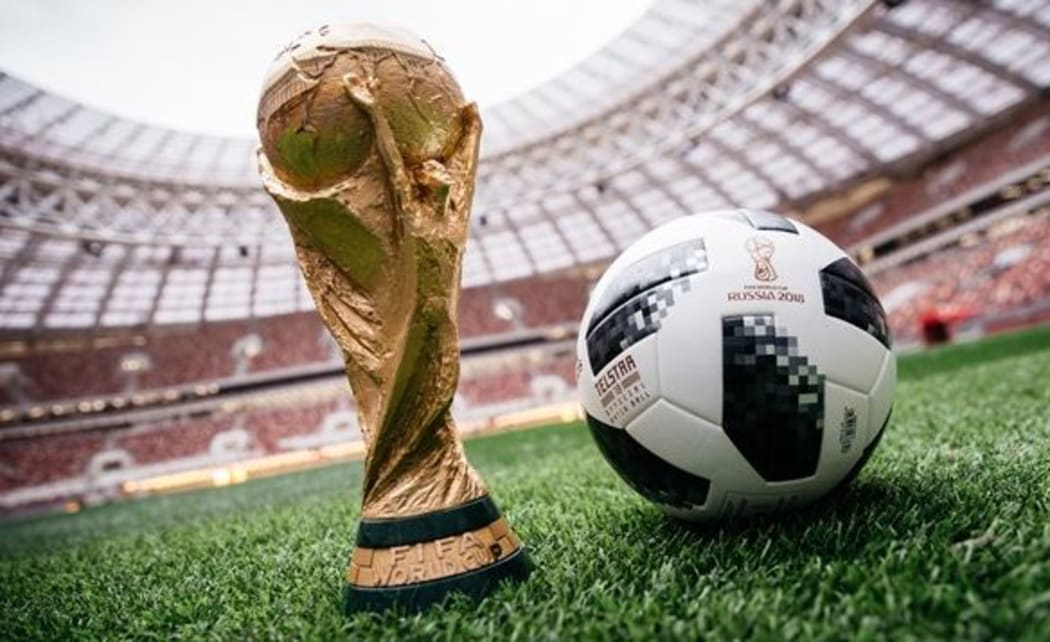 The World Cup trophy and the official ball for the 2018 World Cup in Moscow.