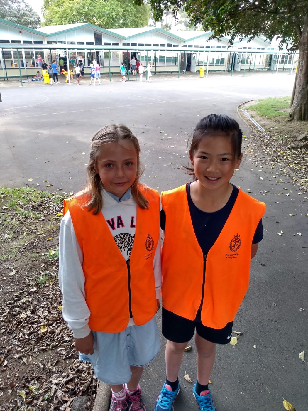 Owairaka District School road patrol students Zoe Coughlan, 10, and Alodia Ke, 10