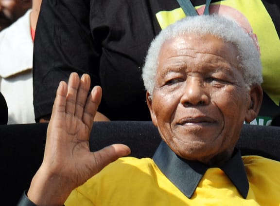 Nelson Mandela greets supporters at an African National Congress (ANC) election rally in 2009.