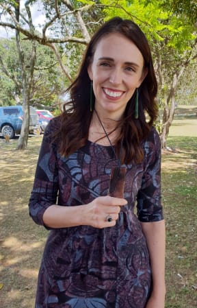 Jacinda Ardern with the gift of a 1400-year-old wooden pendant