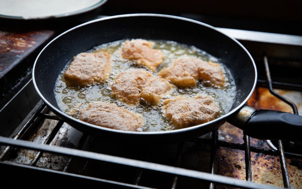 Snapper bites frying in pan.