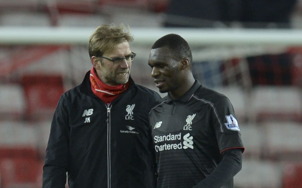 Liverpool's German manager Jurgen Klopp (L) talks with goalscorer Christian Benteke after the final whistle at Sunderland
