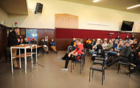 The community listening to Mark Patterson speak at Simpson Park hall in Lawrence, Otago - 29 October 2025