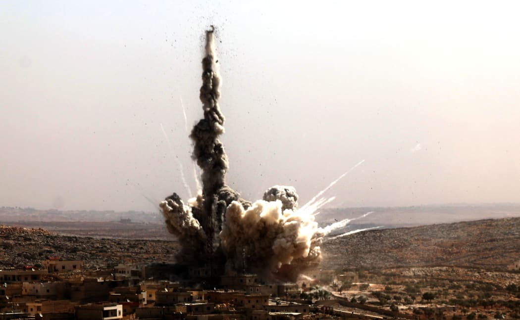 Smoke rises after a residential area in the Darat Izza neighbourhood of Aleppo was bombed, apparently by Russia.