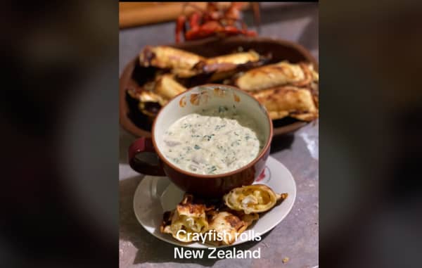 Screenshot of TikTok video by Terressa Kollat, showing her making crayfish rolls.