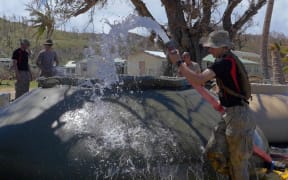 NZ Defence Force sappers install a reverse osmosis system to convert seawater into drinking water to support the NZ contingent and to provide potable water to Lomaloma residents.