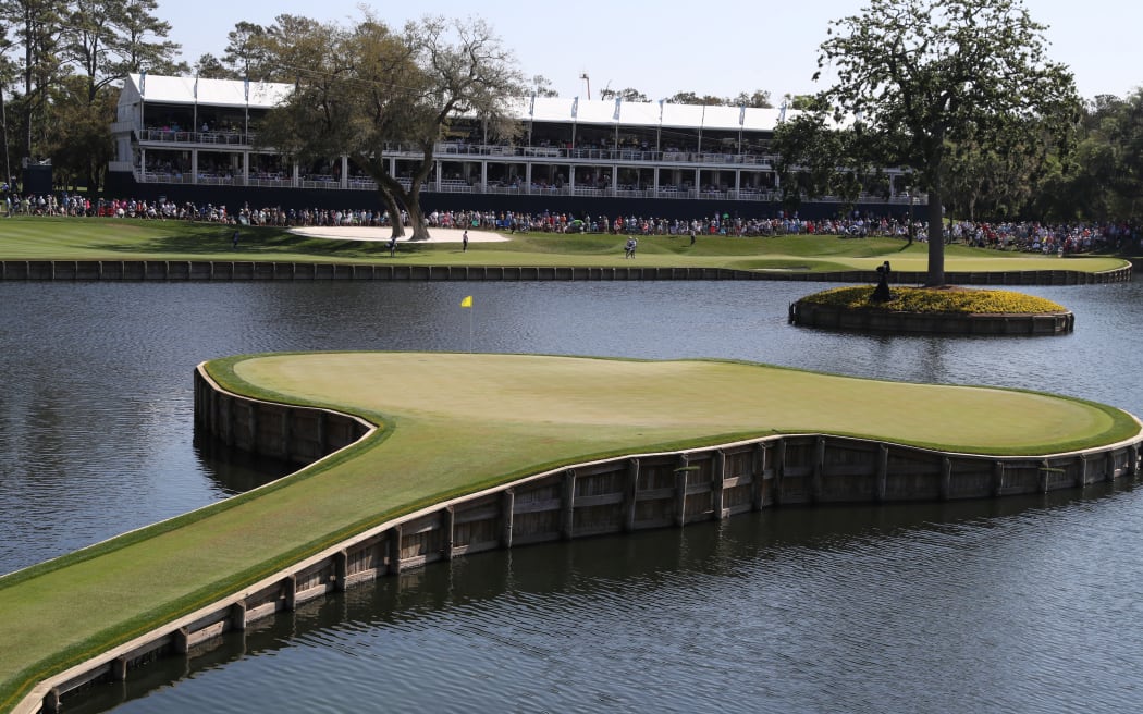 The 17th hole island green at The Players Championship at TPC Sawgrass in Ponte Vedra Beach, Florida.