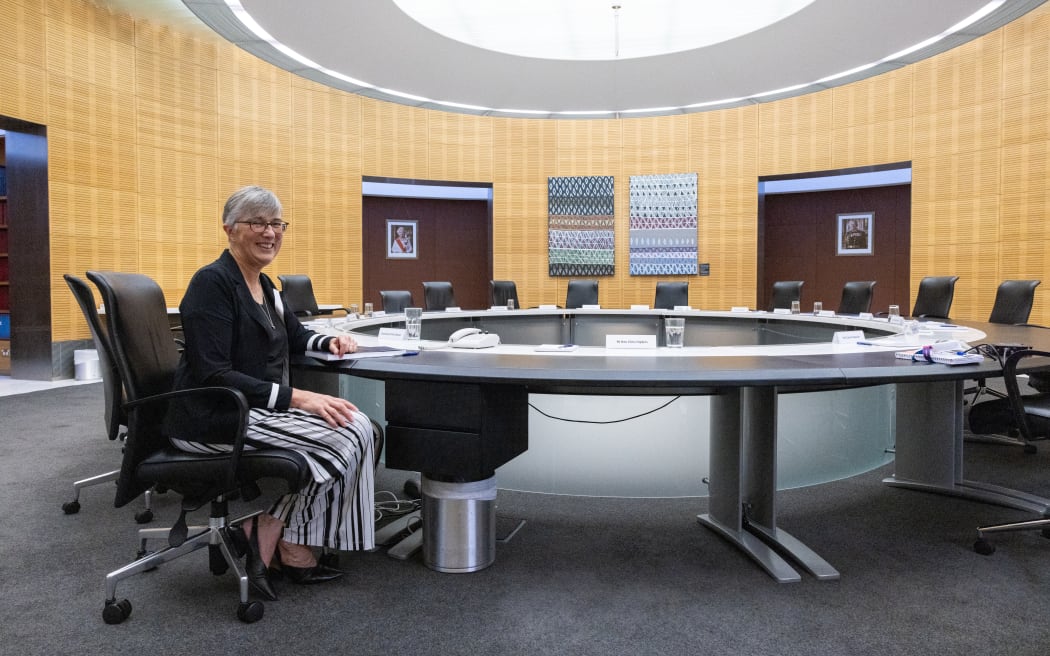 Secretary of Cabinet, Rachel Hayward sits in her chair next to the Prime Minister's place at the cabinet table.